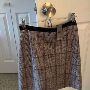 Plaid fully lined skirt fully lined with leather waistband. NEW